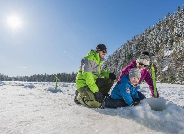 Ice-Fishing on a frozen lake near Akureyri Iceland